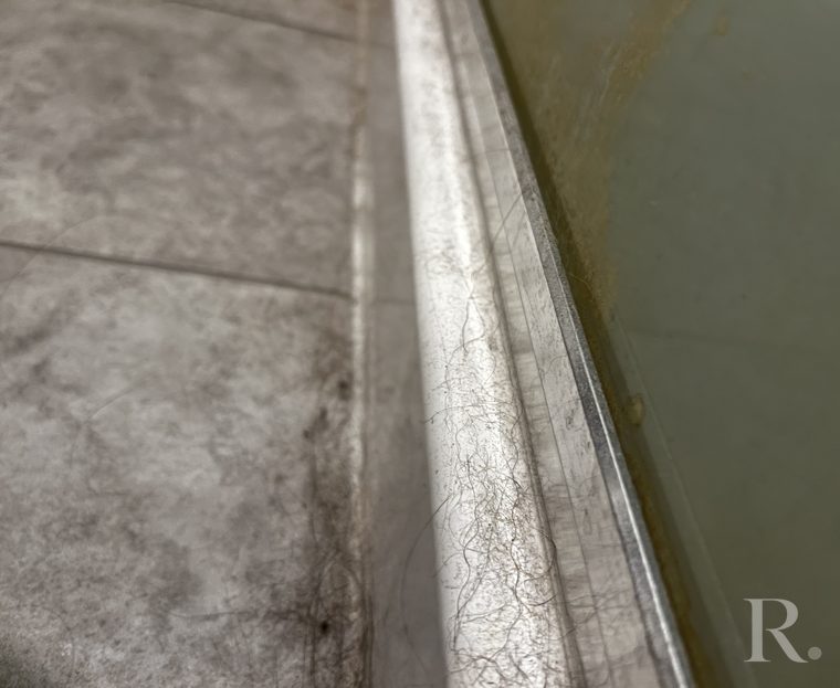 Shower tracks and edges: before cleaning