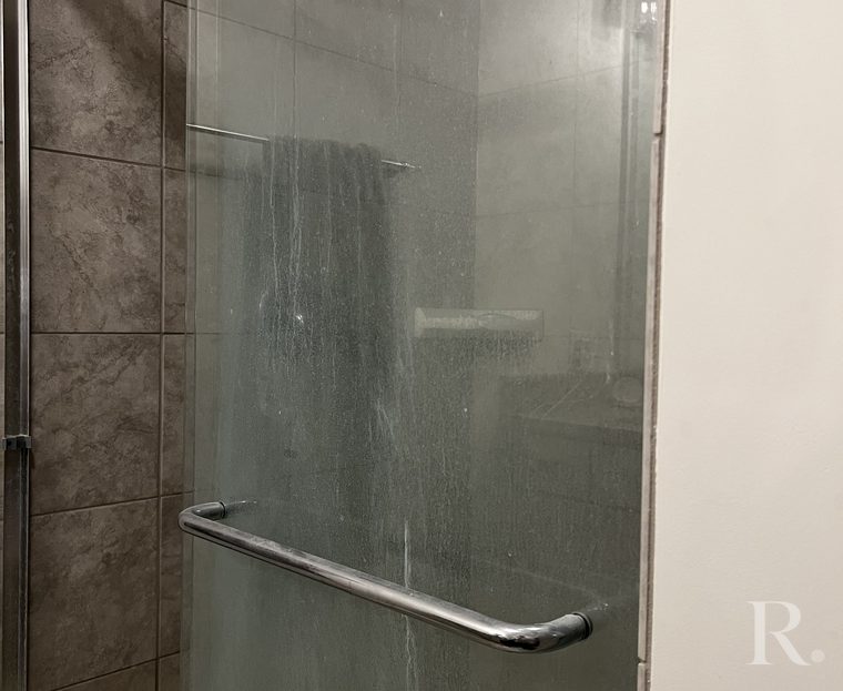 Shower glass, before and after: before cleaning